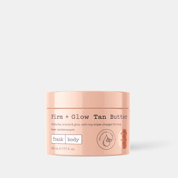 A peach jar of frank body Firm + Glow Tan Butter, 230ml.