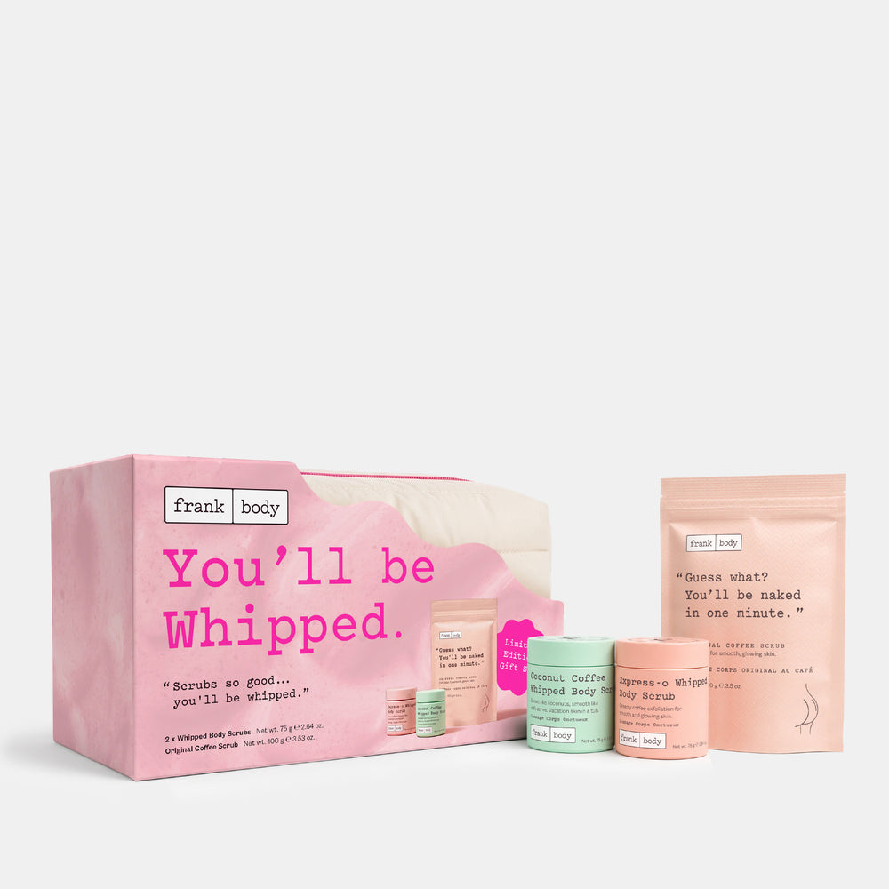A Frank Body gift set on a light gray background, featuring a pink box with the text 'You'll be Whipped.', several small skincare jars in pastel pink, mint green, and peach, and a peach stand-up pouch.