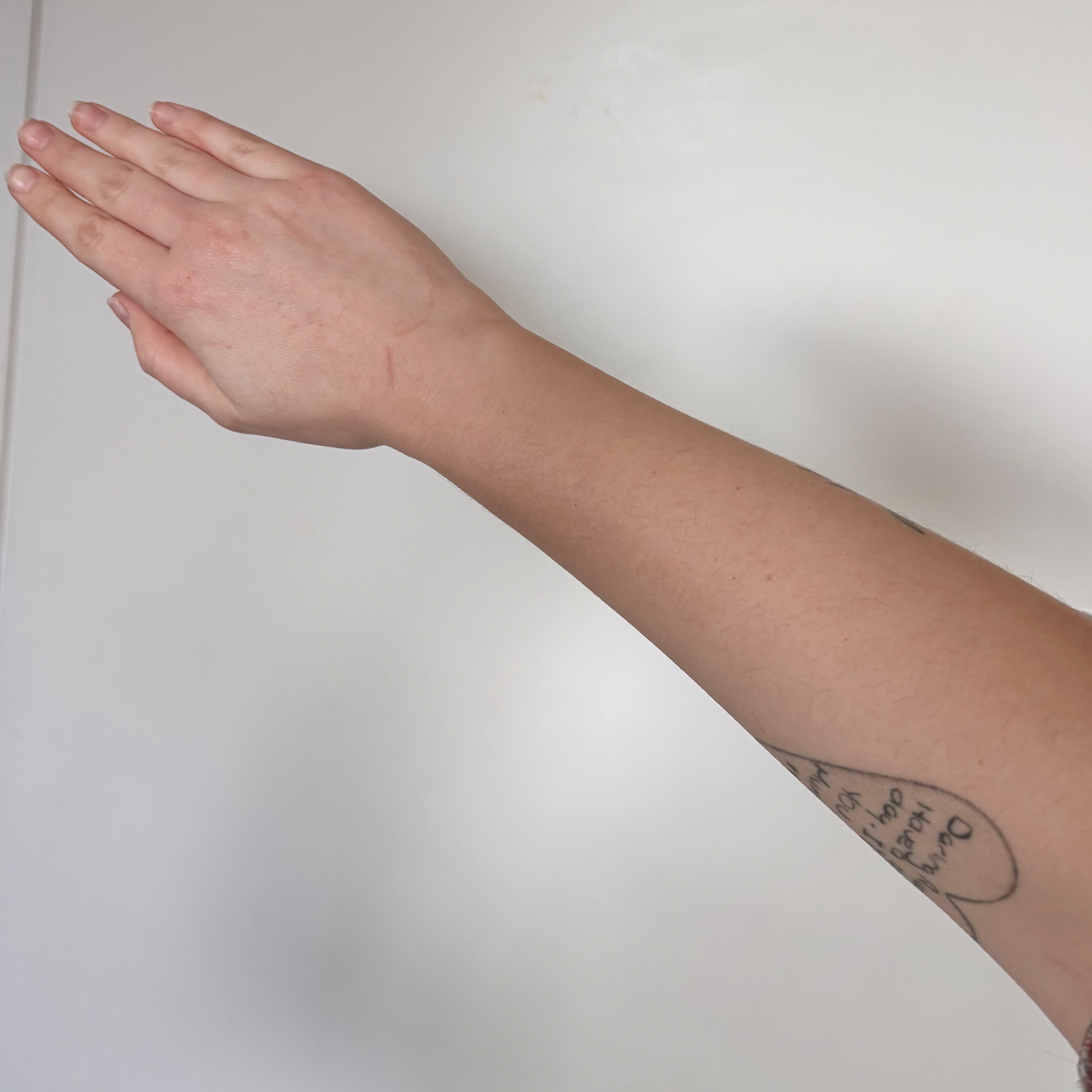 Before using frank body Firm + Glow Tan Butter: a pale, untanned forearm.