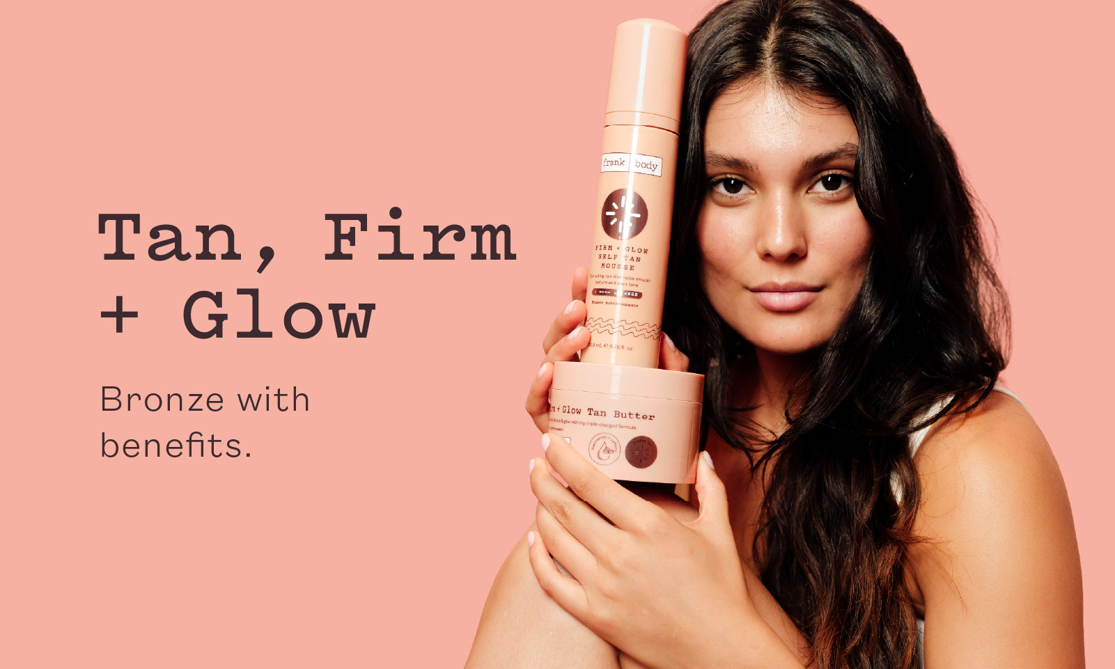 Tan, Firm and Glow category banner: a smiling woman holds a bottle of frank body Firm + Glow self tan. Text reads: Tan, Firm + Glow. Bronze with benefits.