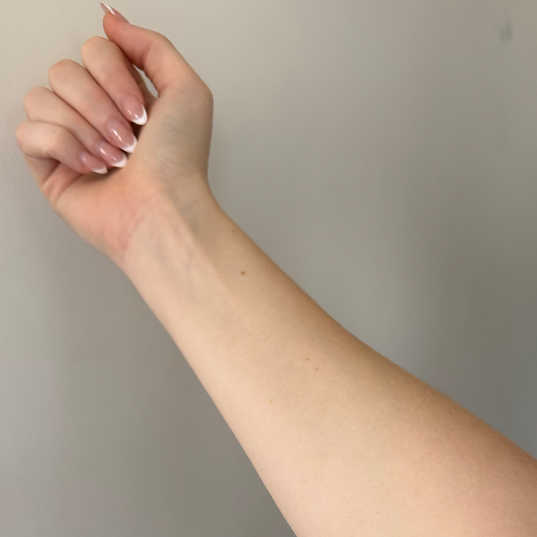 Before using frank body Firm + Glow Self Tan Mousse: a pale, untanned forearm.