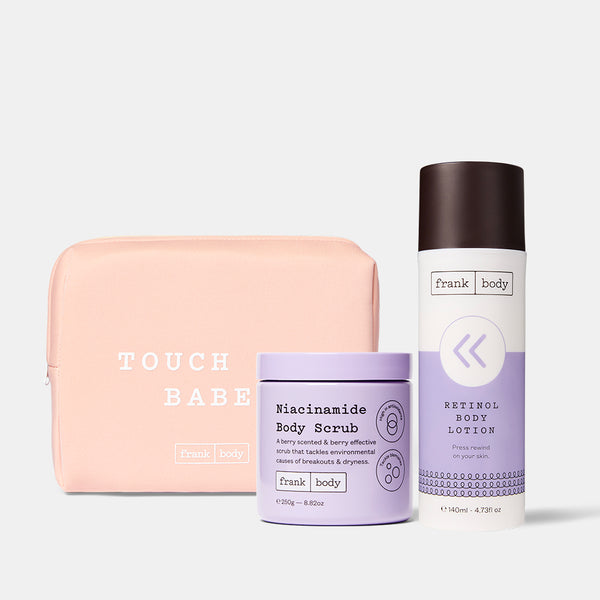 The frank body Rewind Body Duo: Niacinamide Body Scrub and Retinol Body Lotion with a pink Touch Me Babe pouch.